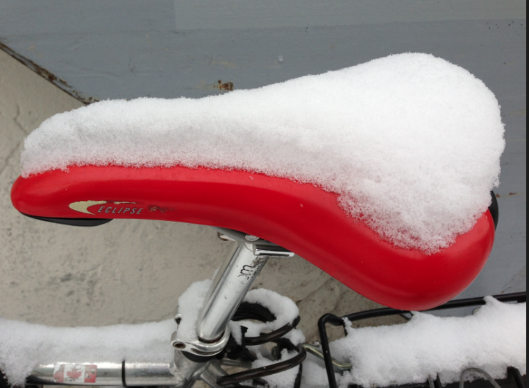 Snowy bike seat in Zurich
